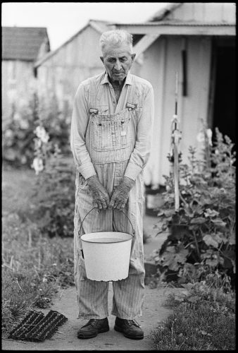 Bucket Man, a photograph by Brian Lanker