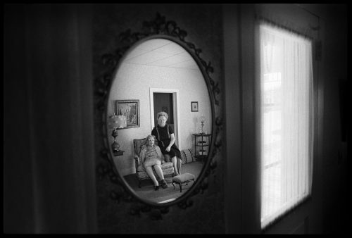 Women in Mirror, a photograph by Brian Lanker