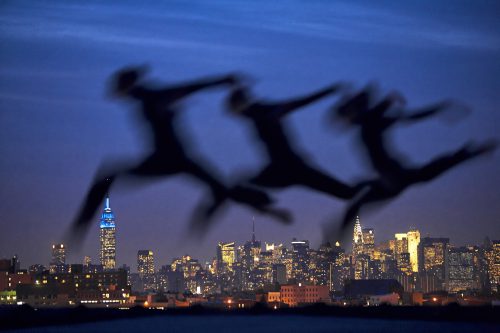 Rooftop Dancers, a photograph by Brian Lanker